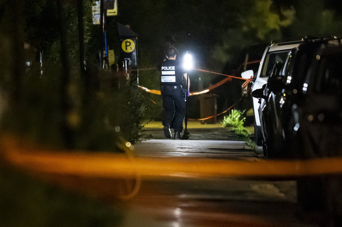 Montreal police outside an apartment building on René-Lévesque Boulevard after a woman's body was found